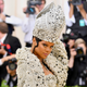 Rihanna in a Stephen Jones papal hat at this year’s Met gala.
